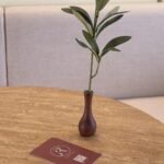 Small wood vases with one olive branch