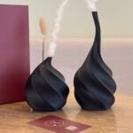 Two white bohemian style vases