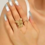 Bloom Stainless Steel Adjustable Ring with a delicate center chain detail.