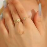 Dainty stainless Steel Adjustable Rings with a delicate center chain detail.